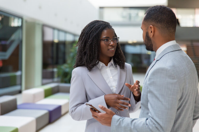 Smiling Young Business People Talking