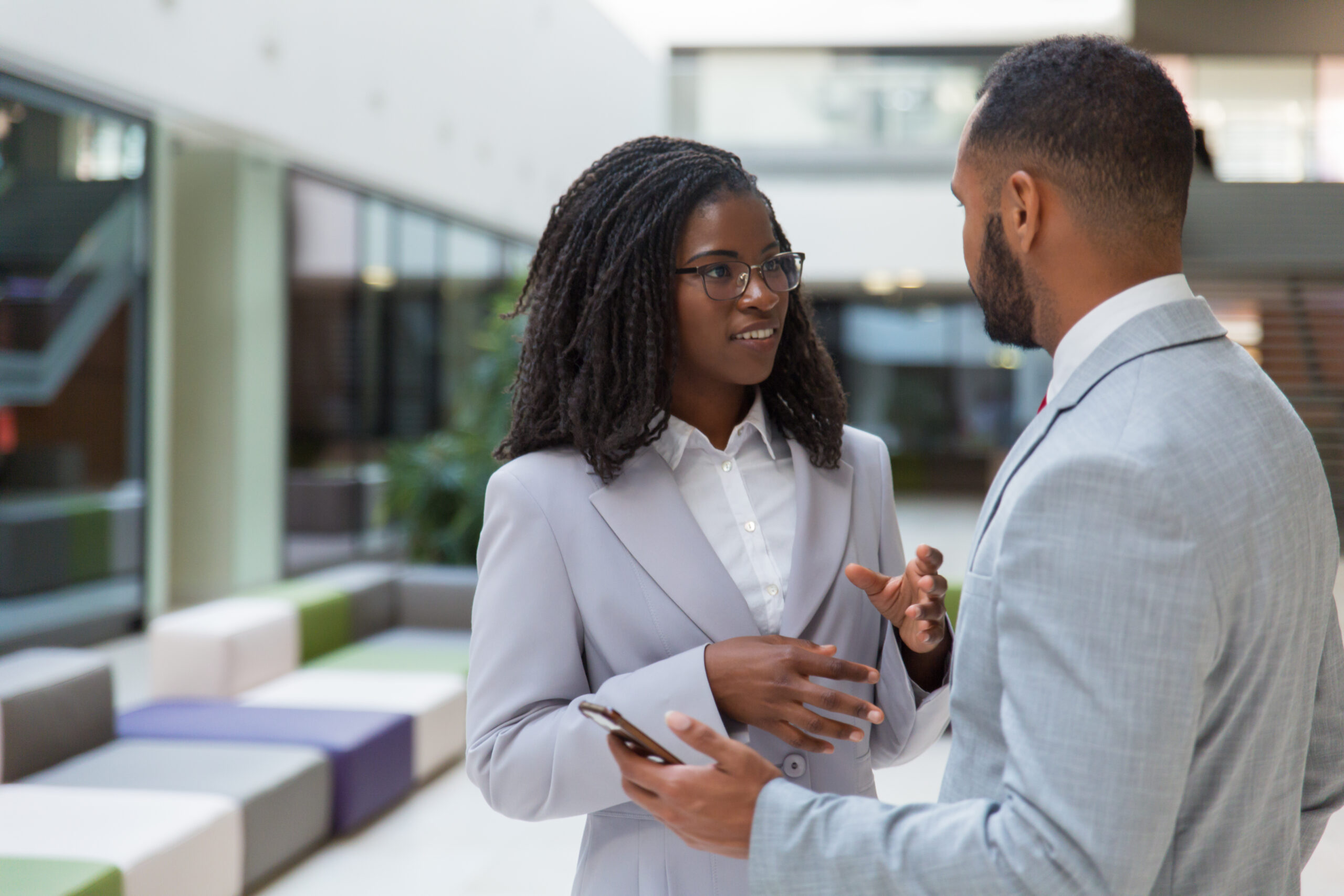 Smiling Young Business People Talking